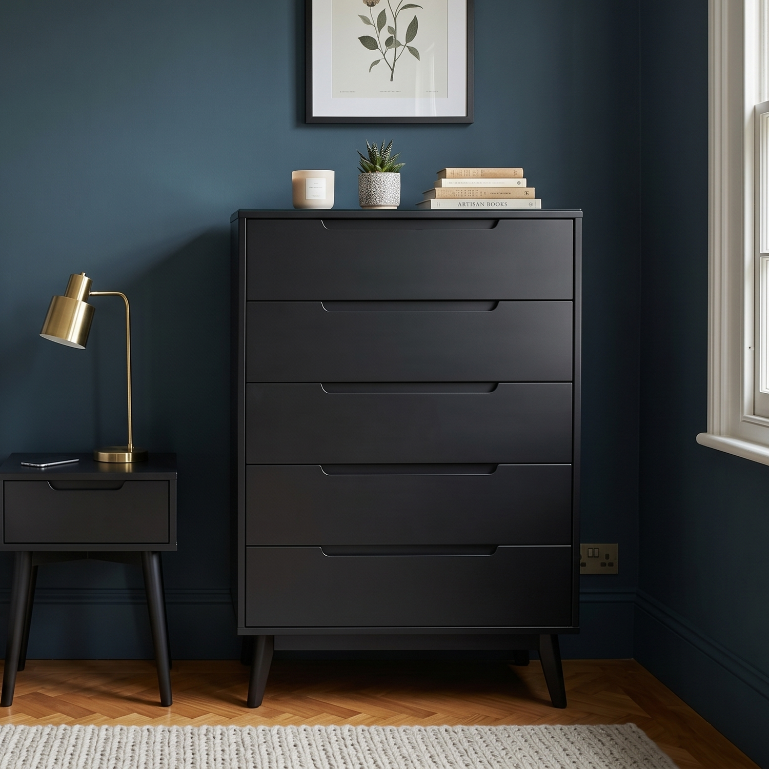 Modern bedroom with a bed, nightstand, and dresser against a dark blue wall.
