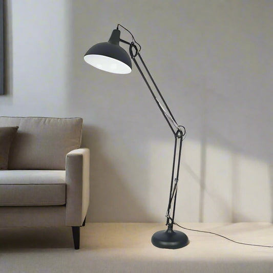 The Alonzo Matt Black Metal Task Floor Lamp - a sleek and contemporary design of the industrial task lamp offering an enhancement to any room. Shop online now at www.nobleandnook.co.uk