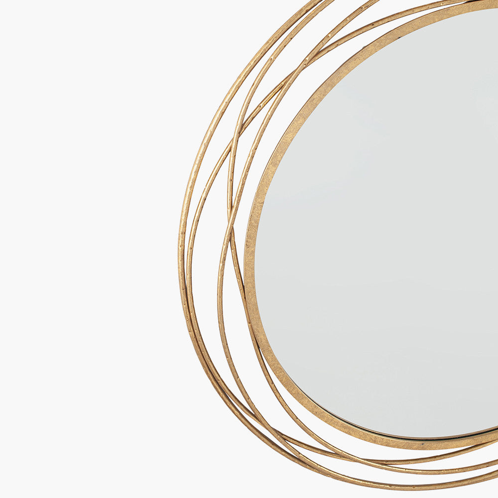 Bring a refined touch to your home with the Antique Gold Metal Swirl Round Wall Mirror. Perfect for your living room, hallway, or bedroom. Shop online now at www.nobleandnook.co.uk