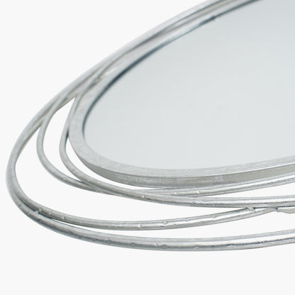 Featuring delicate swirling metalwork finished in a stunning antique silver, this mirror brings light, depth, and elegance to your space. Shop online now at www.nobleandnook.co.uk
