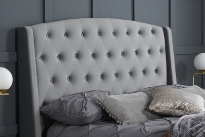 The Balmoral bed frame, a perfect blend of luxury and contemporary elegance. Upholstered in sumptuous grey velvet with striking wingback headboard. Shop online today at www.nobleandnook.co.uk