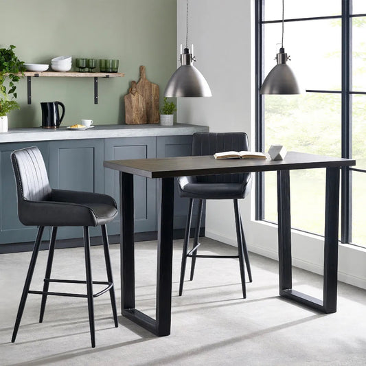Shop the Brooklyn Bar Table in Dark Oak, crafted from solid oak. Ideal for hosting drinks or enjoying casual meals. Dimensions – H96 x D70 x W140 cm. Shop online today at www.nobleandnook.co.uk