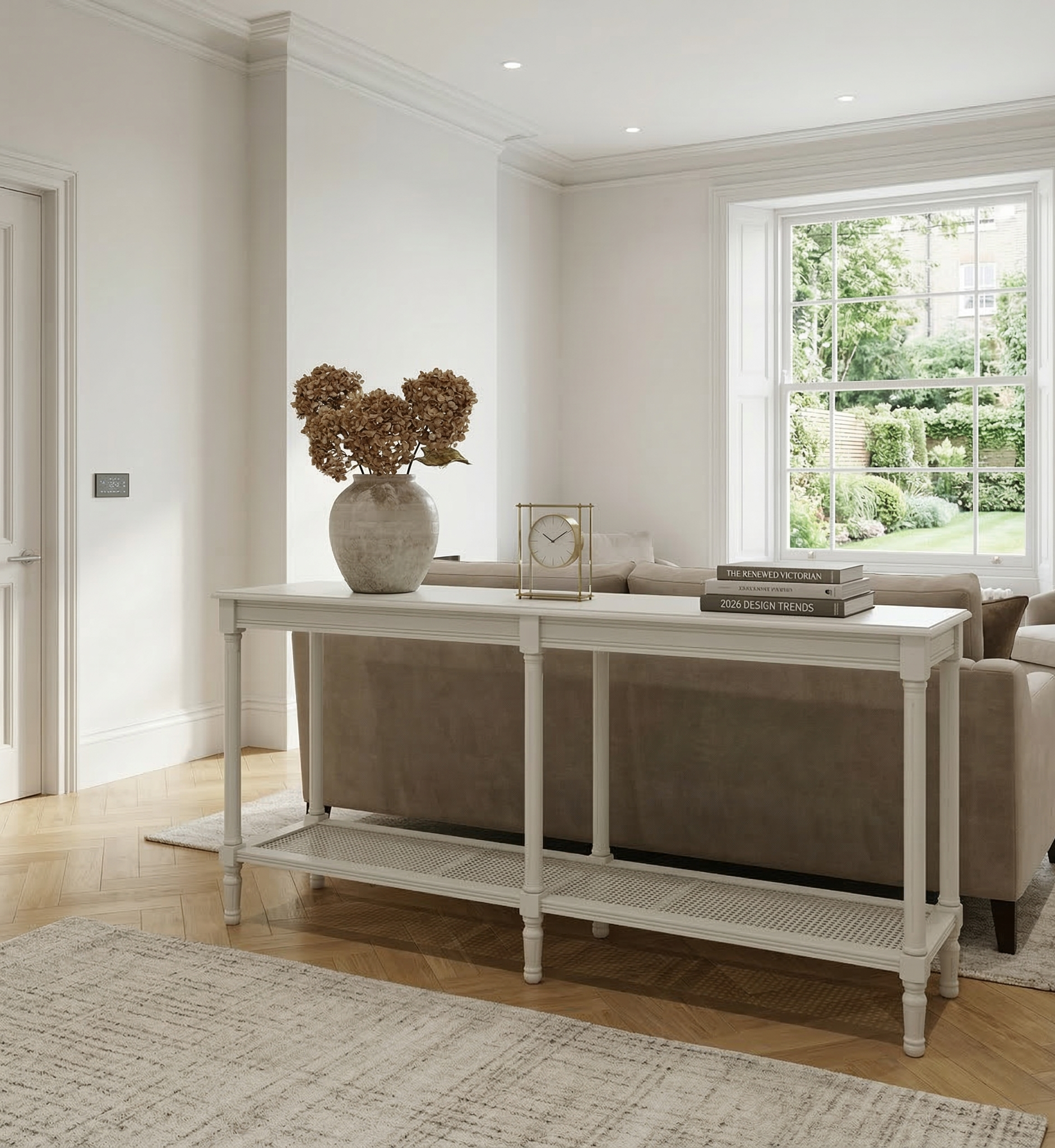 Living room with a console table, sofa, and decorative items.