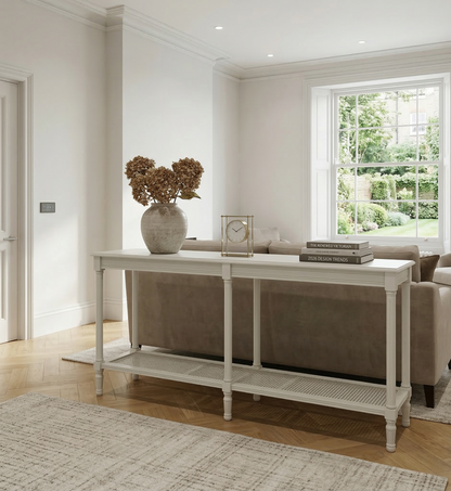 Living room with a console table, sofa, and decorative items.