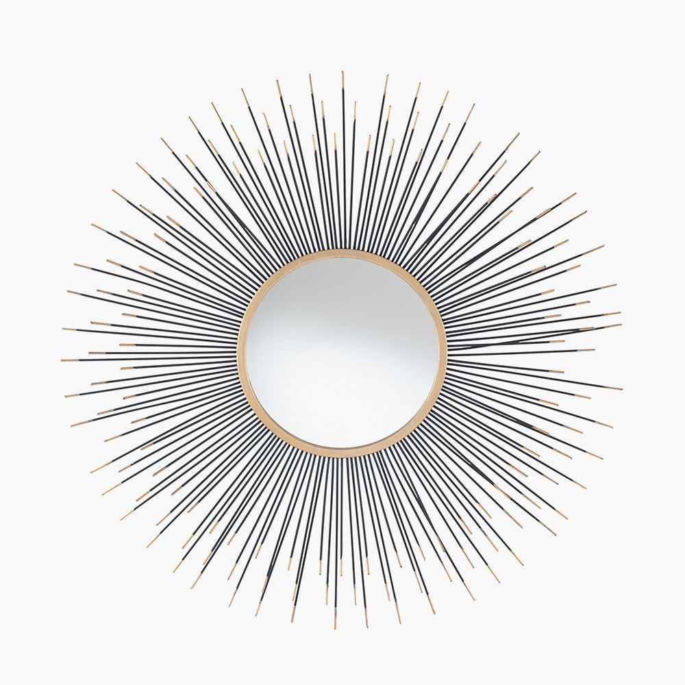 Infuse your space with drama and elegance with the Black and Gold Metal Starburst Design Round Wall Mirror. Shop online now at www.nobleandnook.co.uk