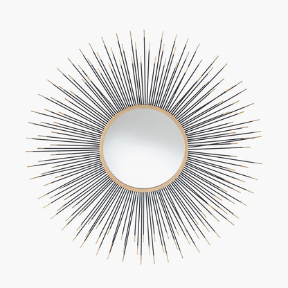 Infuse your space with drama and elegance with the Black and Gold Metal Starburst Design Round Wall Mirror. Shop online now at www.nobleandnook.co.uk