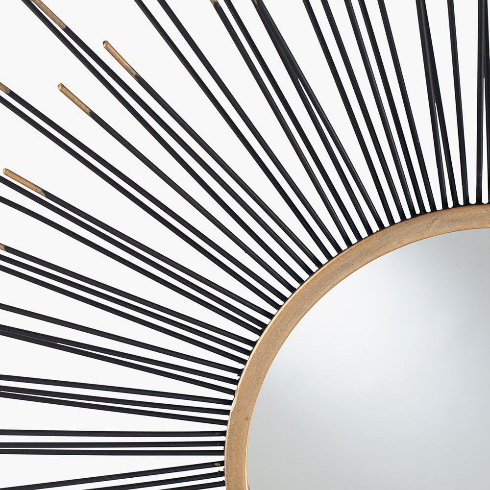 Infuse your space with drama and elegance with the Black and Gold Metal Starburst Design Round Wall Mirror. Shop online now at www.nobleandnook.co.uk