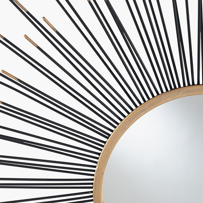 Infuse your space with drama and elegance with the Black and Gold Metal Starburst Design Round Wall Mirror. Shop online now at www.nobleandnook.co.uk