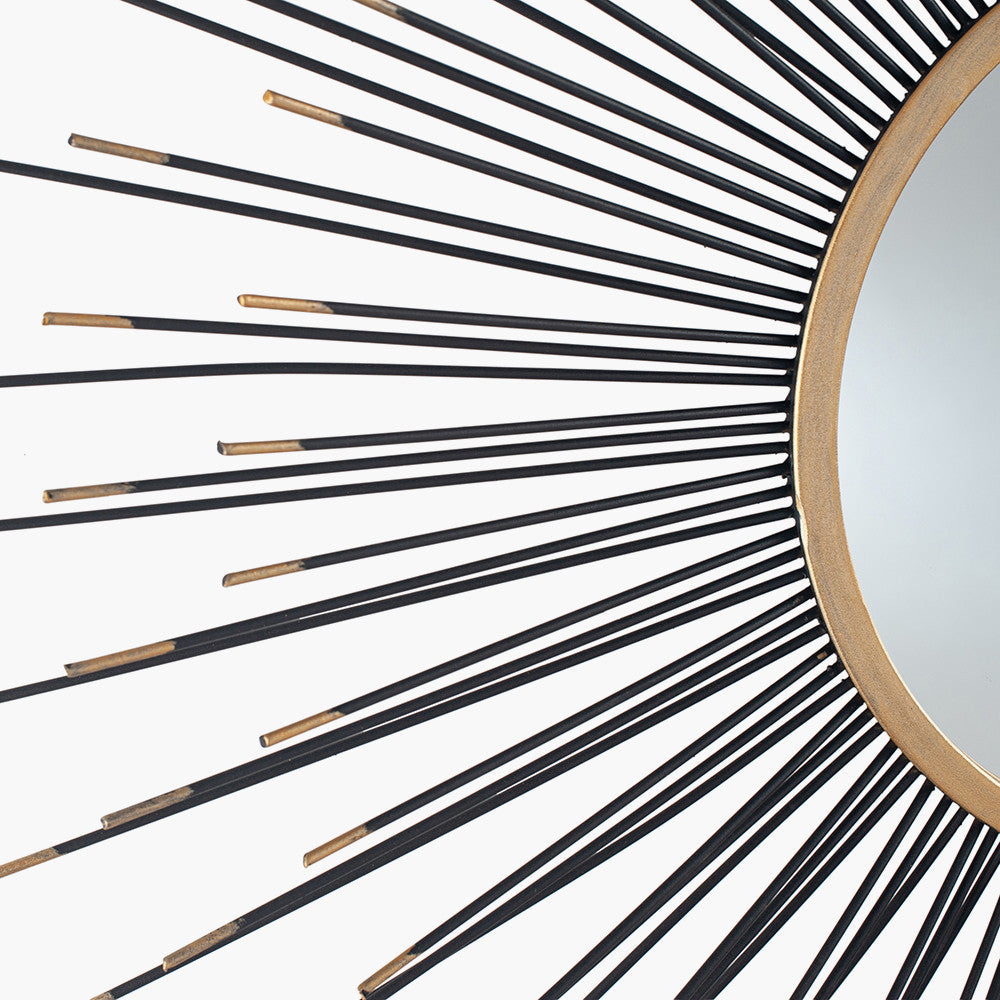 Infuse your space with drama and elegance with the Black and Gold Metal Starburst Design Round Wall Mirror. Shop online now at www.nobleandnook.co.uk