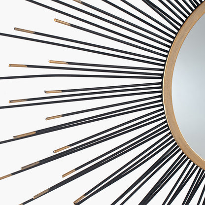 Infuse your space with drama and elegance with the Black and Gold Metal Starburst Design Round Wall Mirror. Shop online now at www.nobleandnook.co.uk