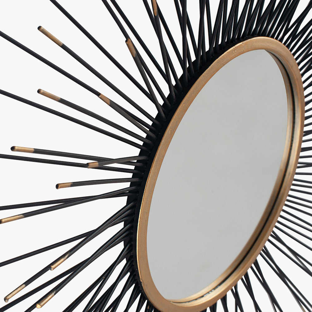 Infuse your space with drama and elegance with the Black and Gold Metal Starburst Design Round Wall Mirror. Shop online now at www.nobleandnook.co.uk