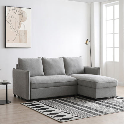 Gray sectional sofa in a modern living room with abstract art and a rug.