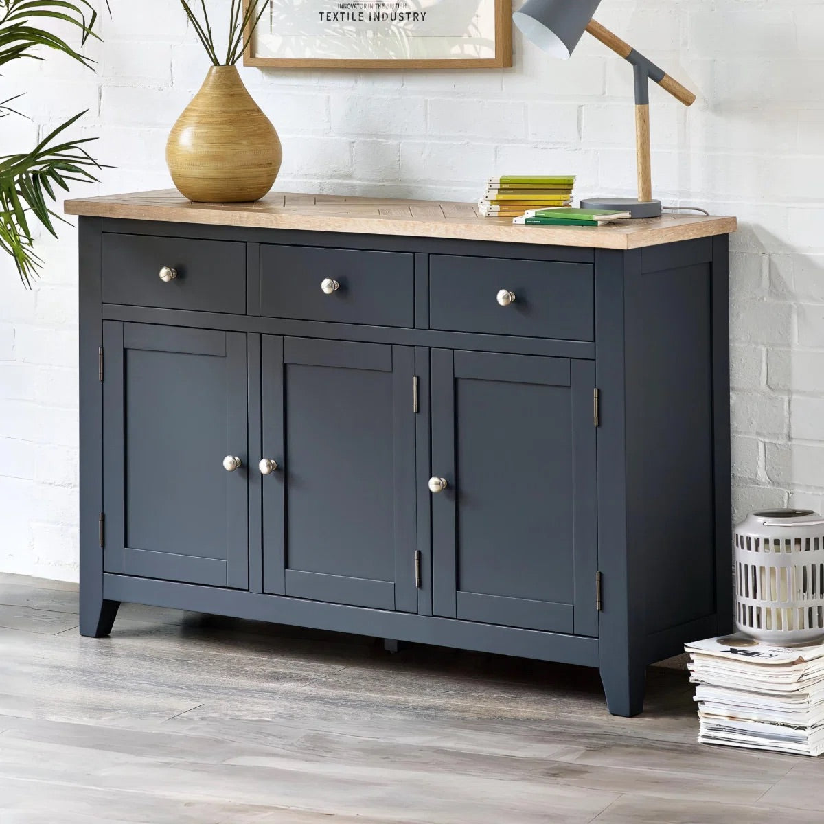 Dark blue sideboard with wooden top in a room setting