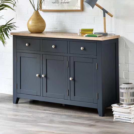 Dark blue sideboard with wooden top in a room setting
