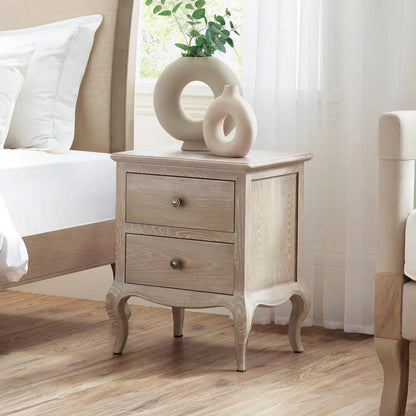 Wooden nightstand with two drawers in a bedroom setting