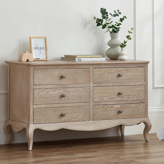 Shop the Camille 6 Drawer Oak Wide Chest, inspired by French design, it features beautiful curves, soft lines and traditional ornate details. FREE UK MAINLAND DELIVERY on orders over £100. Shop online today now at www.nobleandnook.co.uk