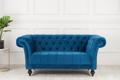 Shop the Chesterfield 2 Seater Sofa in Midnight Blue, combines a timeless charm with modern comfort, making it the perfect addition to any stylish living space. Shop online today at www.nobleandnook.co.uk