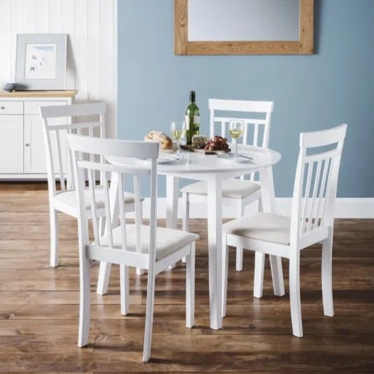 The Coast Drop Leaf 4 Seater Dining Table with two folding leaves allowing you to adapt it for everyday use or entertaining. Finished in a pristine white lacquer. H75 x L55/90 x W90 cm. Available at www.nobleandnook.co.uk