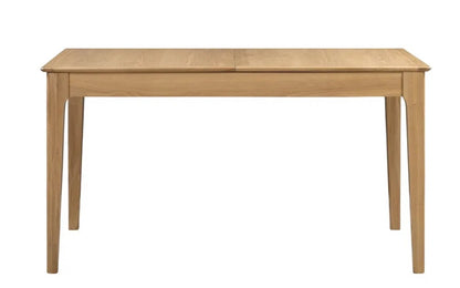 The Cotswold Extending Dining Table, crafted from solid oak and oak veneers, making it a standout piece for both classic and contemporary interiors. Ideal for family dining or entertaining guests