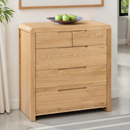 Wooden dresser with three drawers in a room setting