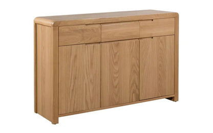 The Curve Oak Sideboard brings together the best of retro charm and modern functionality. Its expertly crafted oak finish and flowing lines measure H85xL130xW40cm. Shop online today at www.nobleandnook.co.uk