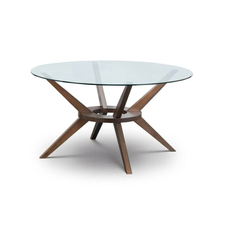 Round Walnut and Glass Dining Table in either 140cm or 120cm diameters, combining a sleek tempered glass top with a beautifully crafted solid wood base in a rich walnut finish. Shop online today at www.nobleandnook.co.uk