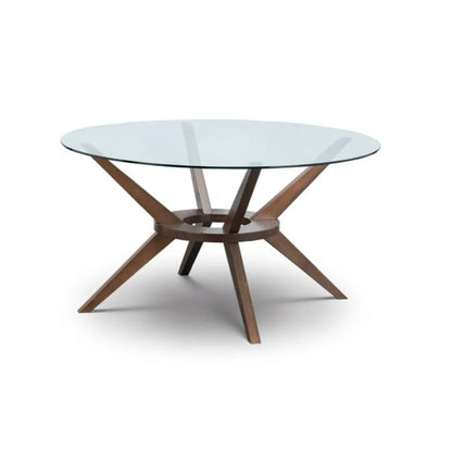 Round Walnut and Glass Dining Table in either 140cm or 120cm diameters, combining a sleek tempered glass top with a beautifully crafted solid wood base in a rich walnut finish. Shop online today at www.nobleandnook.co.uk