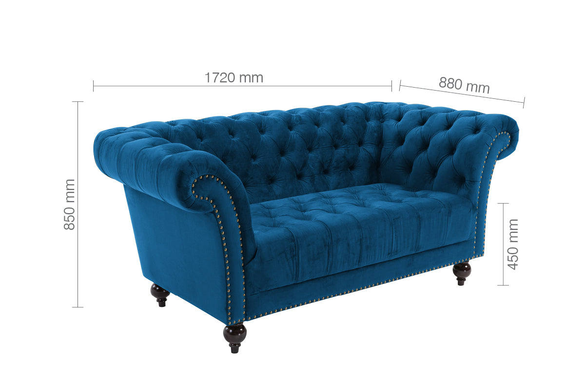 Shop the Chesterfield 2 Seater Sofa in Midnight Blue, combines a timeless charm with modern comfort, making it the perfect addition to any stylish living space. Shop online today at www.nobleandnook.co.uk