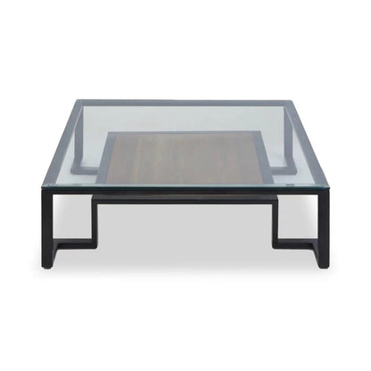 Featuring a refined balance of materials, its clear glass top is perfectly framed by a black metal structure, complemented by a warm teak wood shelf below. Shop online today at www.nobleandnook.co.uk