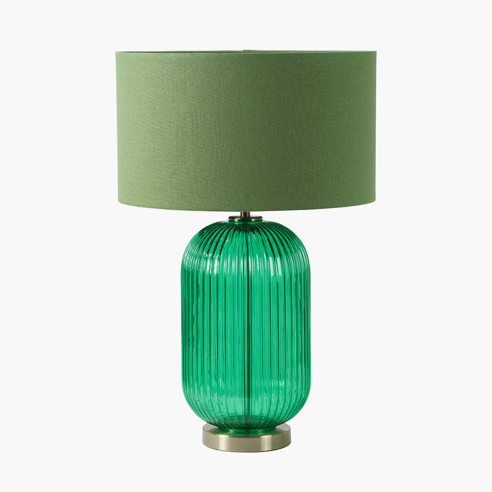 Created in collaboration with the Designers Guild. A blend of premium design and artisanal craft Deep Emerald Ribbed Glass Base with antique brass accents. Ideal for statement lighting in living rooms, bedrooms, or stylish office spaces. Available at www.nobleandnook.co.uk