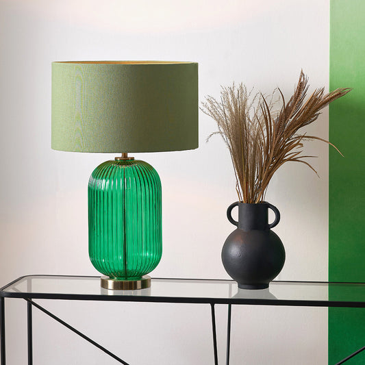 Created in collaboration with the Designers Guild. A blend of premium design and artisanal craft Deep Emerald Ribbed Glass Base with antique brass accents. Ideal for statement lighting in living rooms, bedrooms, or stylish office spaces. Available at www.nobleandnook.co.uk