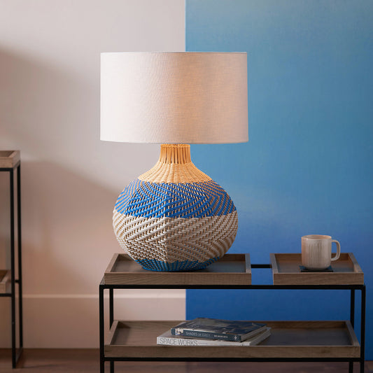 Elevate your home décor with the Brera Large Rattan Table Lamp in Cobalt, a vibrant and textural statement piece crafted in partnership with Designers Guild. Shop online today at www.nobleandnook.co.uk