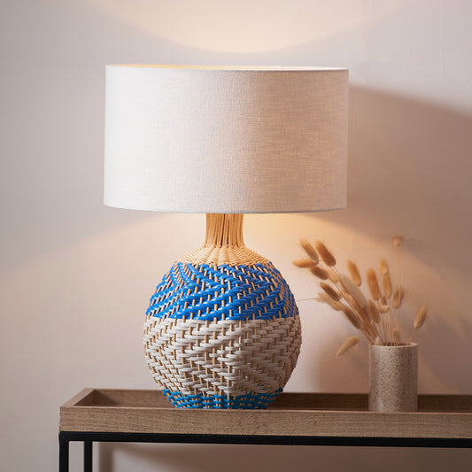 Elevate your home décor with the Brera Small Rattan Table Lamp in Cobalt, a vibrant and textural statement piece crafted in partnership with Designers Guild. Shop online today at www.nobleandnook.co.uk