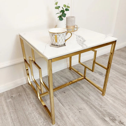 Modern Art Deco Styling – Gold Lamp Table with Polar White Sintered Top – a contemporary piece that blends bold design with practical use. W55xD55xH55cm. Shop online today at www.nobleandnook.co.uk
