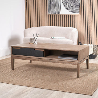 Wooden coffee table with decorative items in a living room setting
