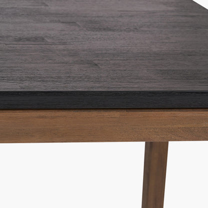 Shop the Gio Black and Natural Acacia Wood 6 Seater Dining Table. Dimensions – W180 x D90 x H76 cm. Perfect for both modern and rustic interiors. Visit www.nobleandnook.co.uk today.