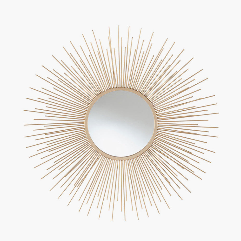Shop Now and add a touch of daring to your home with this flamboyant Gold Metal Starburst Design Round Wall Mirror. Shop online now at www.nobleandnook.co.uk