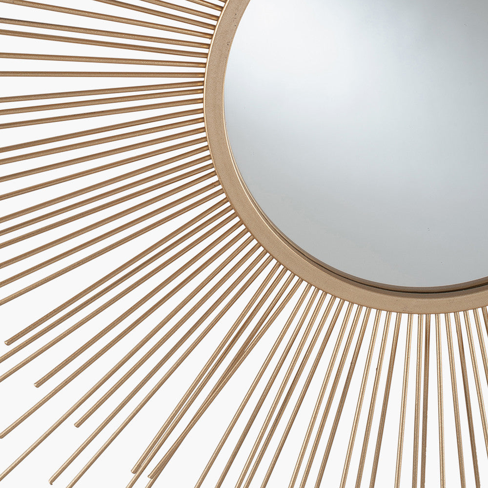 Shop Now and add a touch of daring to your home with this flamboyant Gold Metal Starburst Design Round Wall Mirror. Shop online now at www.nobleandnook.co.uk