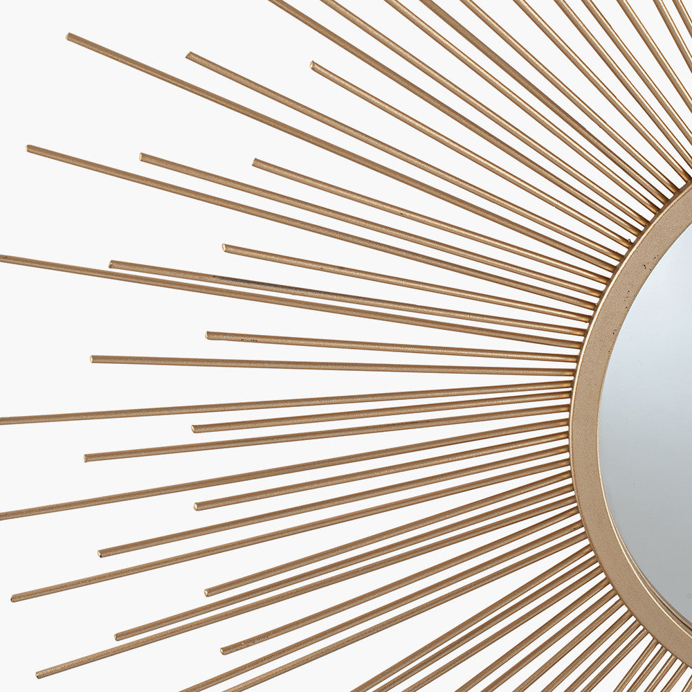Shop Now and add a touch of daring to your home with this flamboyant Gold Metal Starburst Design Round Wall Mirror. Shop online now at www.nobleandnook.co.uk