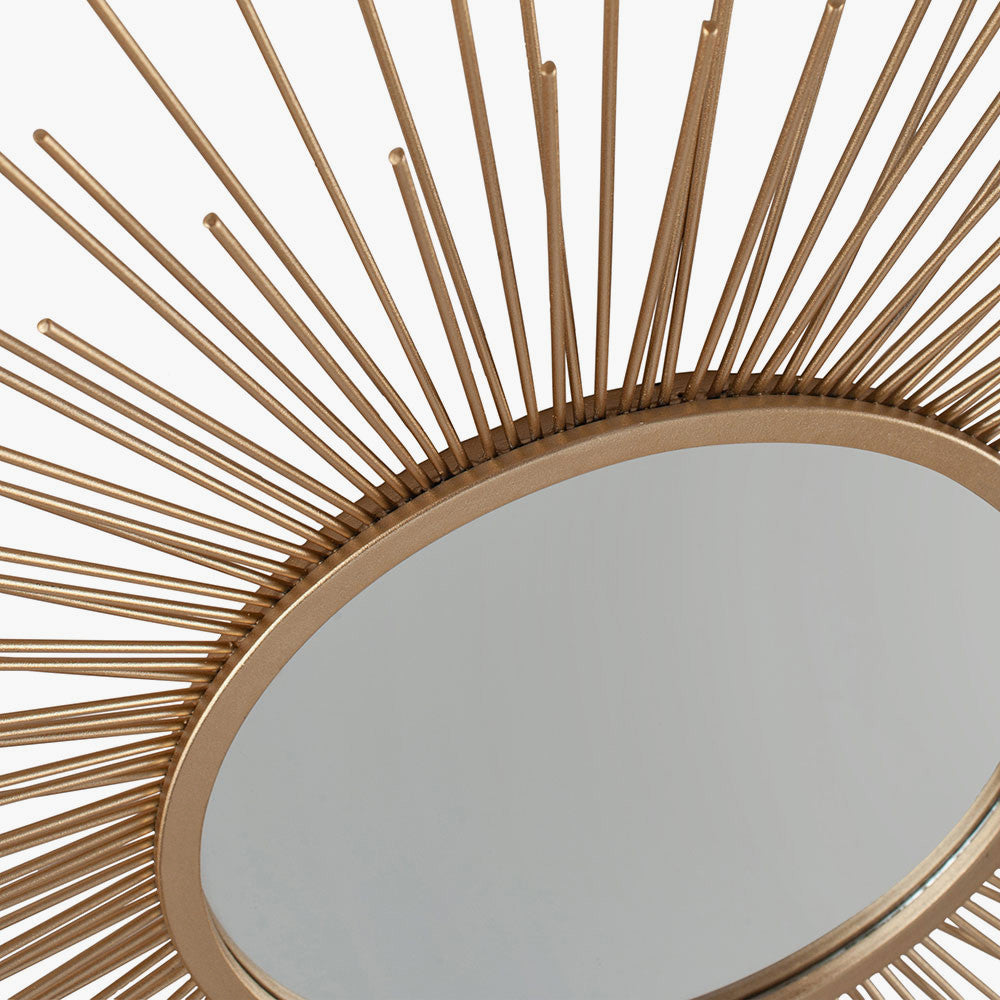 Shop Now and add a touch of daring to your home with this flamboyant Gold Metal Starburst Design Round Wall Mirror. Shop online now at www.nobleandnook.co.uk