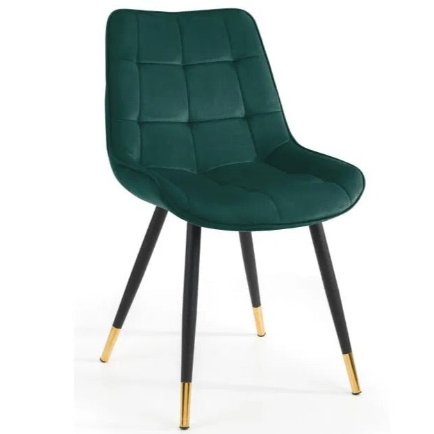 The Hadid Dining Chair brings sophistication to your space with its soft green velvet upholstery and eye-catching black-and-gold leg design. Pair them with a sleek dining table. Shop online today at www.nobleandnook.co.uk