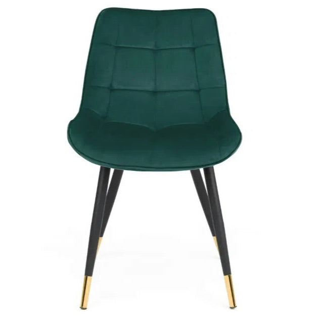The Hadid Dining Chair brings sophistication to your space with its soft green velvet upholstery and eye-catching black-and-gold leg design. Pair them with a sleek dining table. Shop online today at www.nobleandnook.co.uk