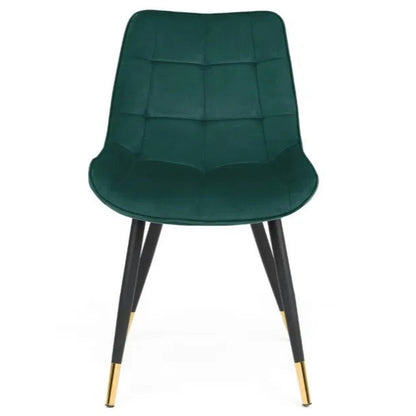 The Hadid Dining Chair brings sophistication to your space with its soft green velvet upholstery and eye-catching black-and-gold leg design. Pair them with a sleek dining table. Shop online today at www.nobleandnook.co.uk