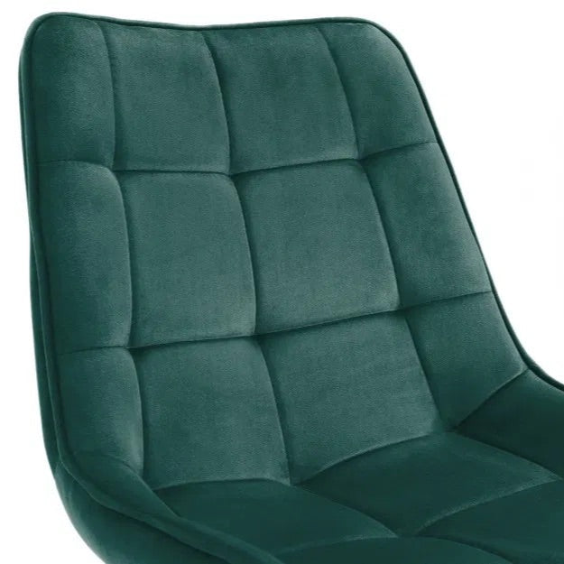 The Hadid Dining Chair brings sophistication to your space with its soft green velvet upholstery and eye-catching black-and-gold leg design. Pair them with a sleek dining table. Shop online today at www.nobleandnook.co.uk