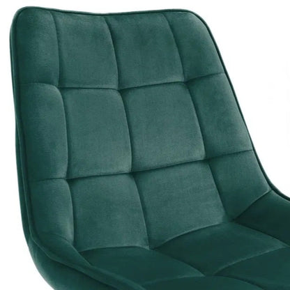 The Hadid Dining Chair brings sophistication to your space with its soft green velvet upholstery and eye-catching black-and-gold leg design. Pair them with a sleek dining table. Shop online today at www.nobleandnook.co.uk