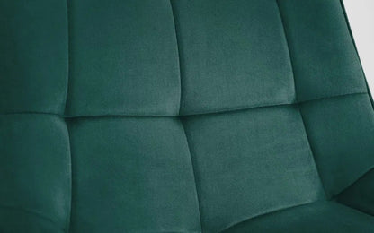 The Hadid Dining Chair brings sophistication to your space with its soft green velvet upholstery and eye-catching black-and-gold leg design. Pair them with a sleek dining table. Shop online today at www.nobleandnook.co.uk