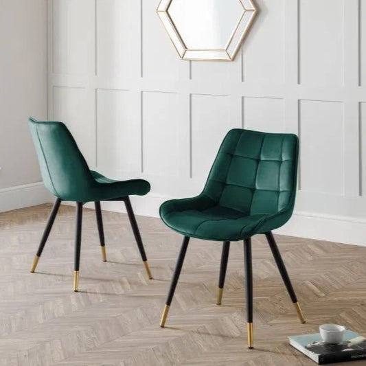 The Hadid Dining Chair brings sophistication to your space with its soft green velvet upholstery and eye-catching black-and-gold leg design. Pair them with a sleek dining table. Shop online today at www.nobleandnook.co.uk