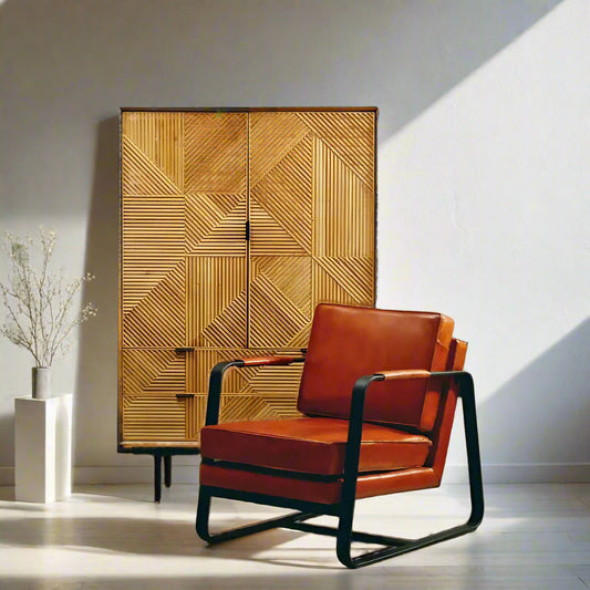 This Hazelnut Brown Leather Armchair features genuine tan leather upholstery and a sleek black iron frame, offering both comfort and durability. Free UK Mainland Delivery. Shop online today at www.nobleandnook.co.uk