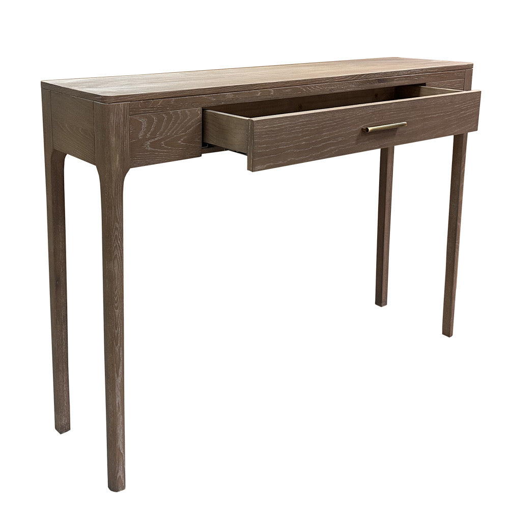 A modern wooden console table with a medium brown finish, featuring four tapered legs and one open drawer with a slim metal pull handle, shown against a plain white background.