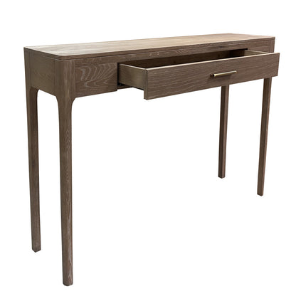 A modern wooden console table with a medium brown finish, featuring four tapered legs and one open drawer with a slim metal pull handle, shown against a plain white background.